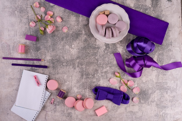 Beautiful pink tasty macaroons on a concrete background