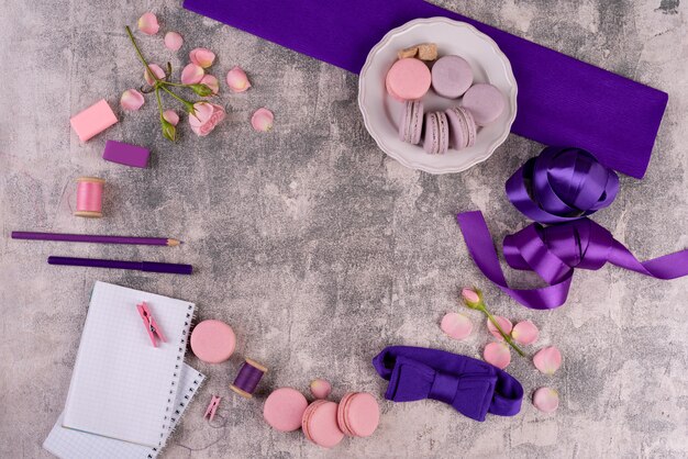 Beautiful pink tasty macaroons on a concrete background