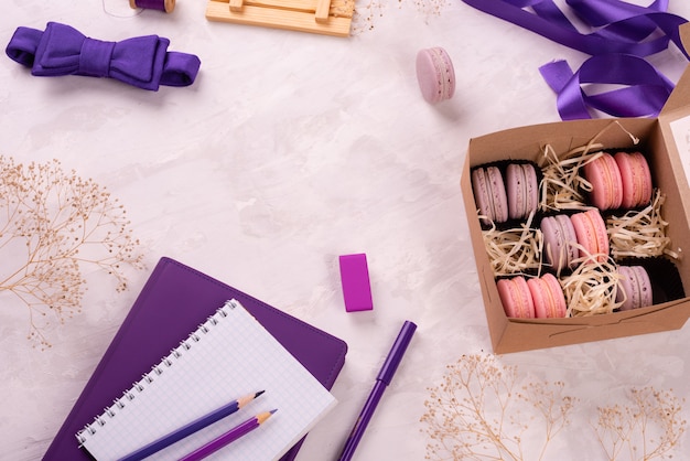 Beautiful pink tasty macaroons on a concrete background