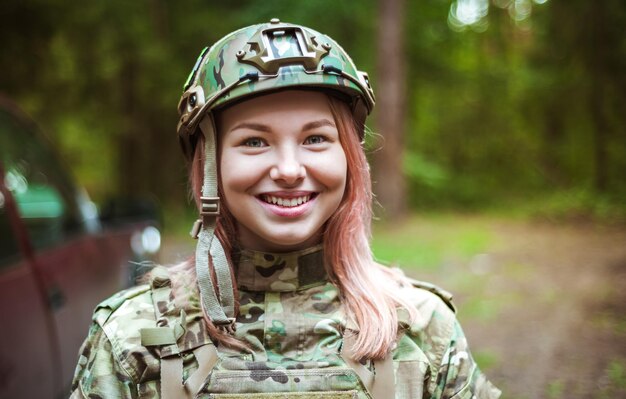 Beautiful portrait of a girl holding a gun