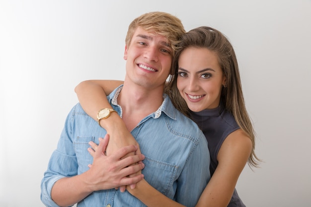 Beautiful portrait of a happy caucasian couple over white