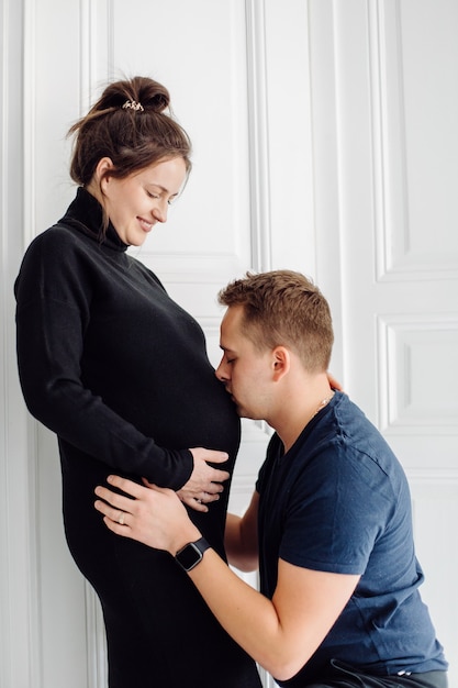 Beautiful pregnancy of young family. Pregnant woman and man. Happy couple, wife and husband