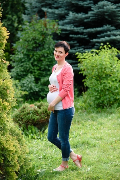 Beautiful pregnant girl in nature.