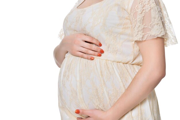 Beautiful pregnant woman posing isolated on white background