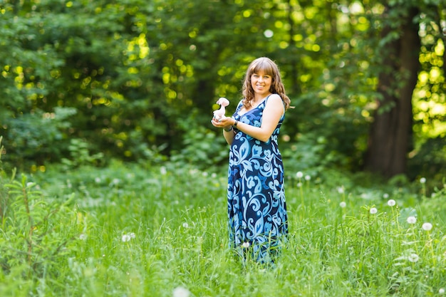 Beautiful pregnant woman relaxing outdoors