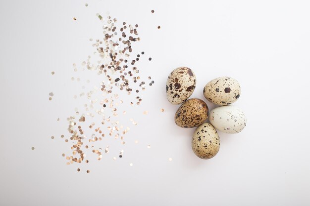 Beautiful quail eggs decorated with flowers and glitter glitter Easter eggs