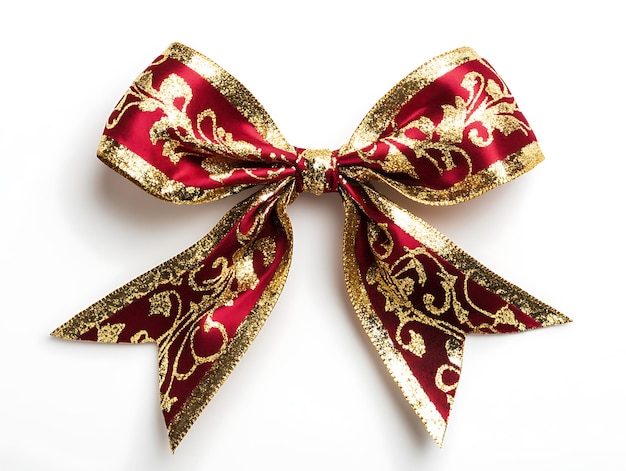 Photo beautiful red and gold ribbon tied into a festive bow on a luxurious golden patterned background for christmas or holiday gift wrapping