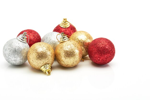 beautiful red gold and silver Christmas balls on white