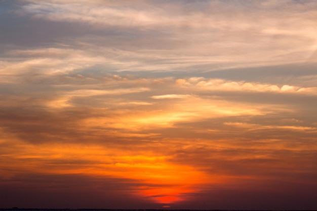 Beautiful red sunset and bright sun on the horizon