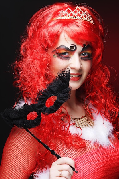 Beautiful redhair woman with mask