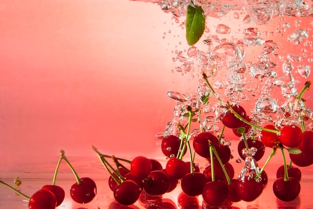 Beautiful ripe berries in water in air bubbles