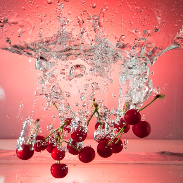 Beautiful ripe berries in water in air bubbles