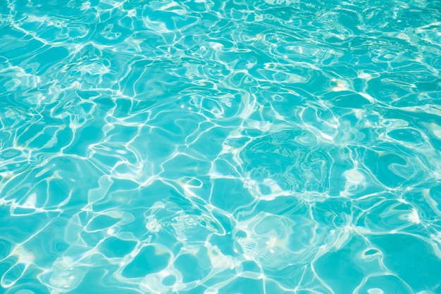 Photo beautiful ripple wave and blue water surface in swimming pool, blue water for background and abstract