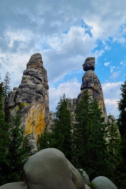 Beautiful rocks in the forest against the blue sky