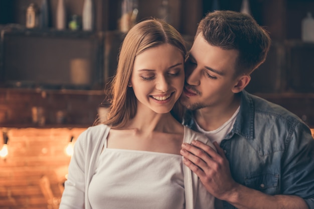 Beautiful romantic couple are hugging and smiling