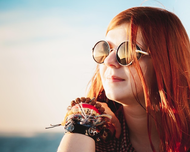 Beautiful romantic young woman in sunset light