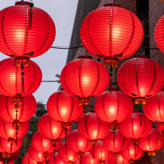 Beautiful round red lantern hanging on old traditional street, concept of Chinese lunar new year festival, close up..