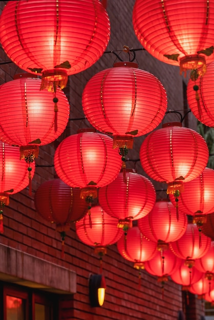 Beautiful round red lantern hanging on old traditional street, concept of Chinese lunar new year festival, close up..