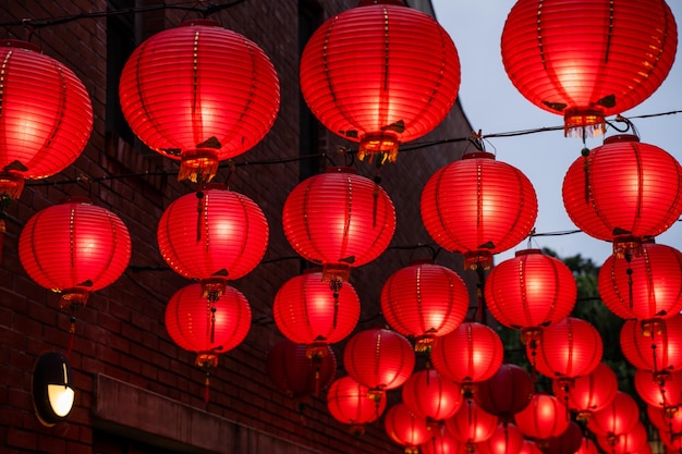 Beautiful round red lantern hanging on old traditional street concept of Chinese lunar new year festival in Taiwan close up The undering word means blessing