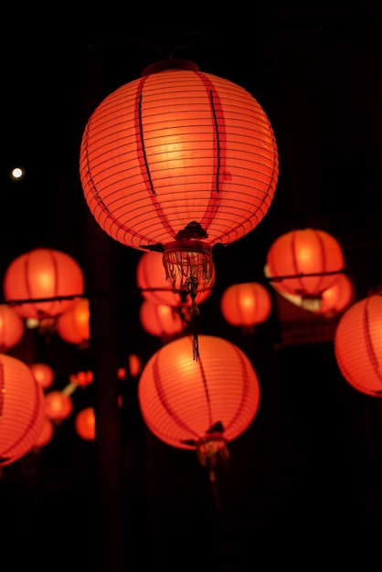 Beautiful round red lantern hanging on old traditional street concept of Chinese lunar new year festival in Taiwan close up The undering word means blessing