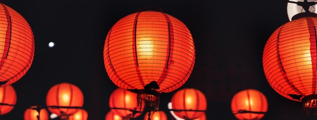 Beautiful round red lantern hanging on old traditional street concept of Chinese lunar new year festival in Taiwan close up The undering word means blessing