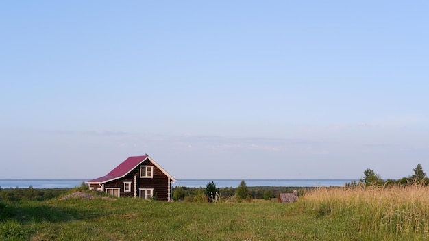 Beautiful rustic summer landscape Old wooden log houses Vologda region