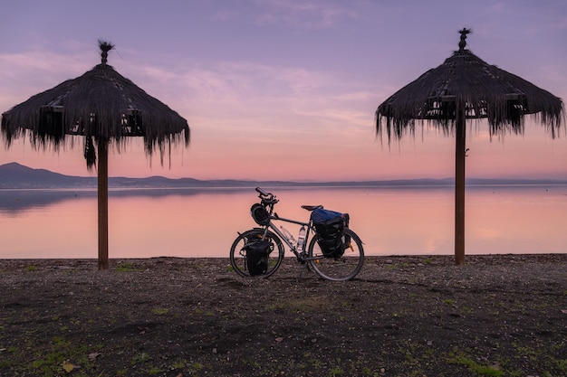 Beautiful scene of travel bike on sunset