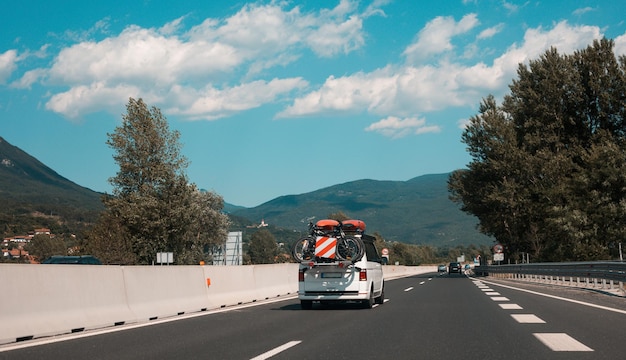 Beautiful scenic landscape on mountains covered with forests View from the car window on a modern and highquality highway