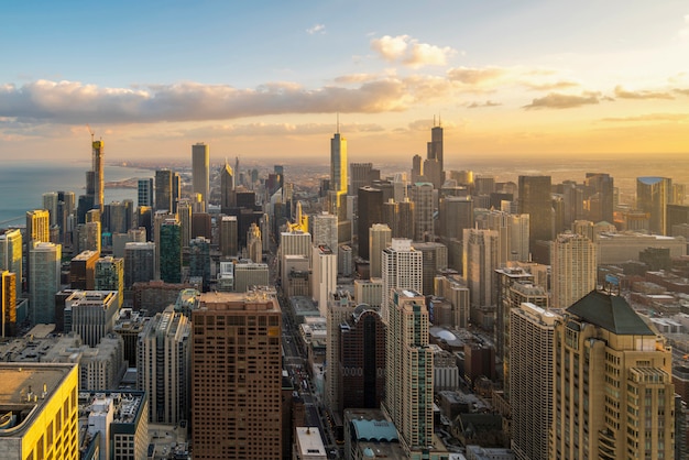 Beautiful scenic view of business district of Chicago loop with skyline in evening sunlight. Panoramic view aerial top view or drone architecture view of city. Famous attraction in Chicago, USA.