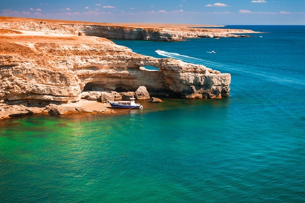 Beautiful sea coast with turquoise water and rocks. Tarhankut Cape on the western coast of Crimea peninsula. Summer seascape, famous travel destination