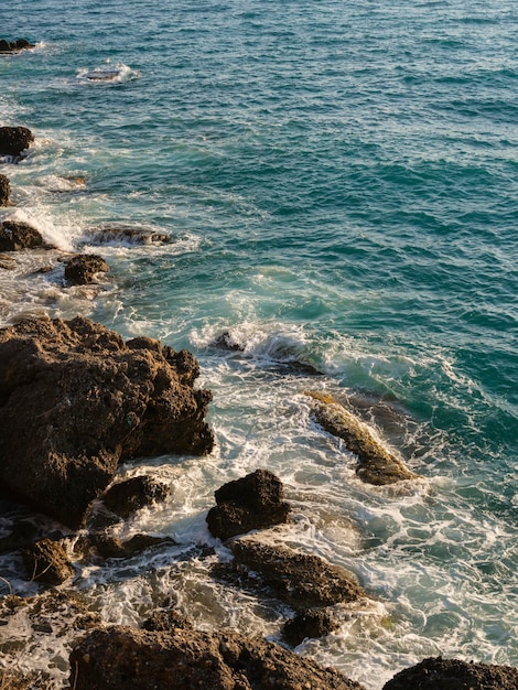 Beautiful sea waves crashing on the cliffs