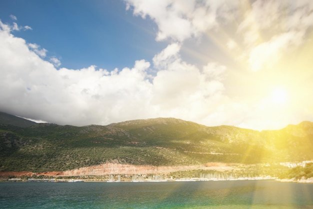 Beautiful seascape green rocky coast and turquoise water in the sunlight