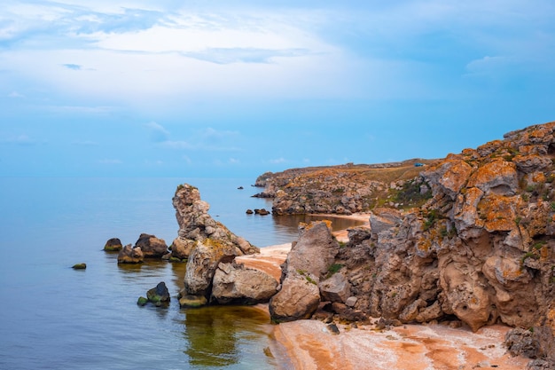 Beautiful seascape Sandy beach with rocky sea coast top view Travel and tourism