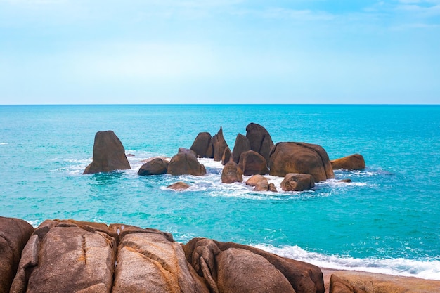 Beautiful seascape of Thailand A group of stones in the azure water of the sea