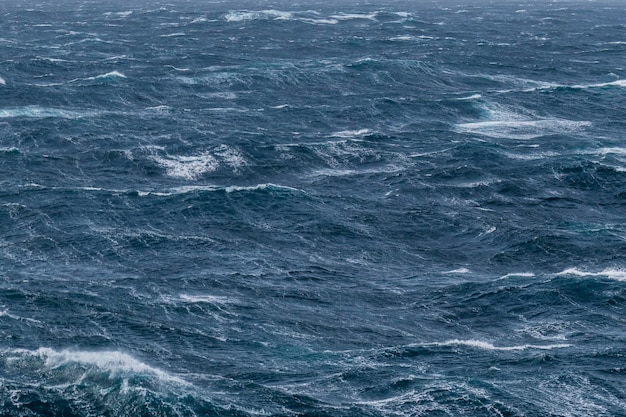 Beautiful seascape waves and sky with clouds with beautiful lighting Stormy sea Bad weather Gale Rough sea