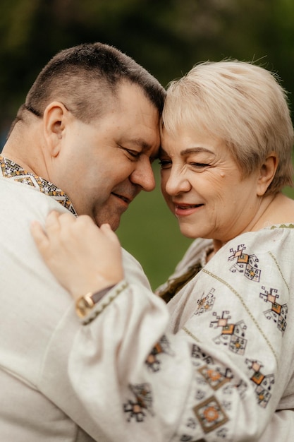 Beautiful senior couple walking in spring park