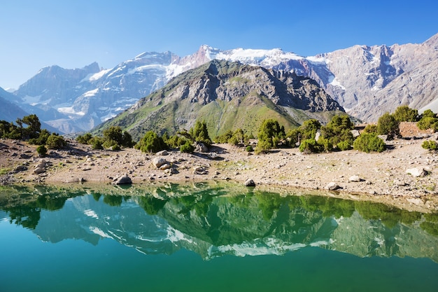 Beautiful serene lake in  Fanns mountains (branch of Pamir) in Tajikistan.