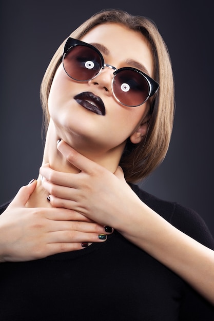 Beautiful sexy woman with black lips and perfect hair