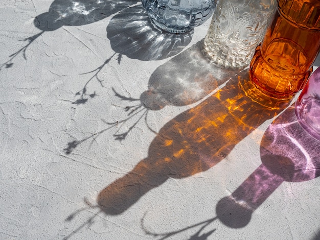 Beautiful shadows from glass vases in harsh light.