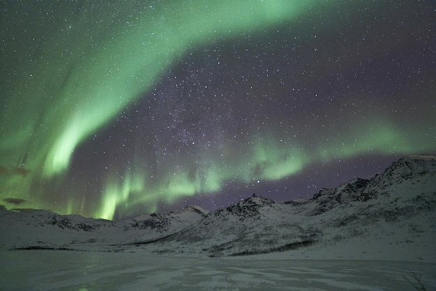 Beautiful shot of bright green Northern Lights in Tromso, Norway