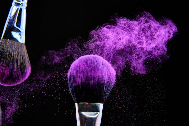 Beautiful shot of makeup brush isolated on black background