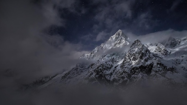 Beautiful shot of rocky mountains covered with white snow