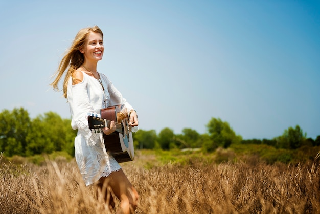 Beautiful singer songwriter with her guitar