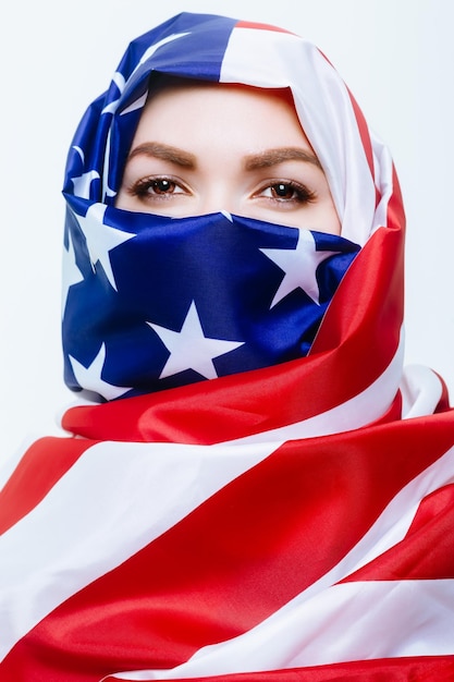 Beautiful sirian woman wearing a hijab from the american flag