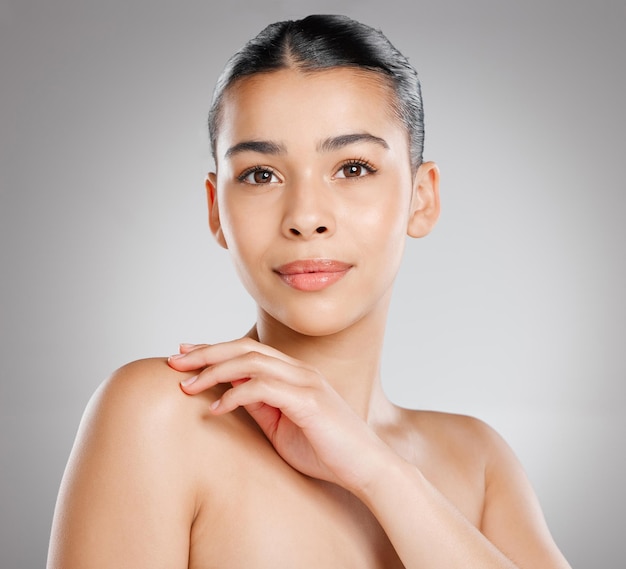 Beautiful skin starts from within Studio shot of an attractive young woman posing against a grey background