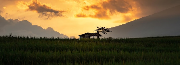 Beautiful Sky at Sunset with Cottage Silhouette