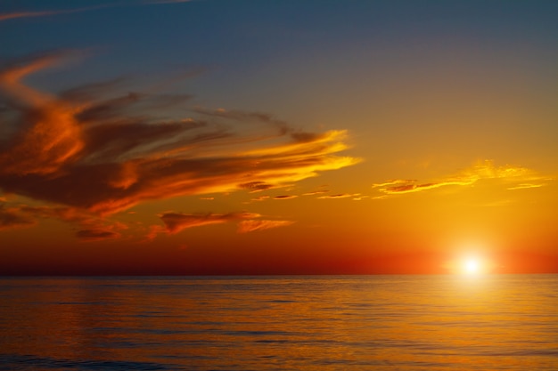 Beautiful sky with clouds at sunset over the sea