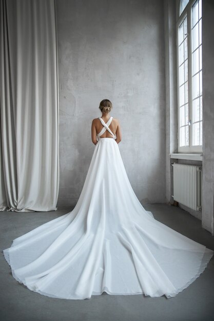 Beautiful slender woman in white wedding dress