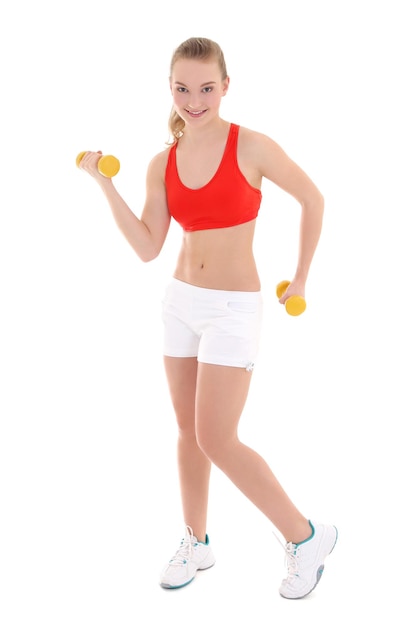 Beautiful slim woman with dumbbells over white background