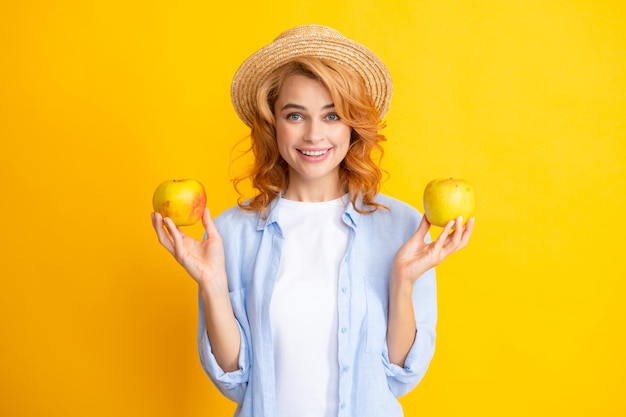 Beautiful smile of young woman holding apple